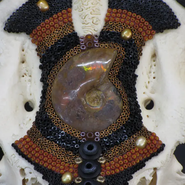 An image of a Crowned Prince with beads on it.