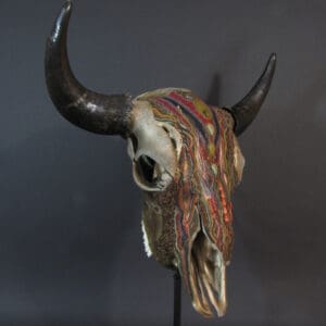 A Thantanjka with colorful horns on a stand.