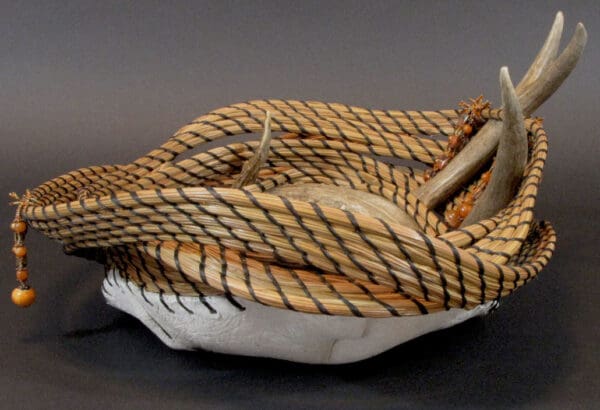 A basket with Twisted Fate and a piece of wood.